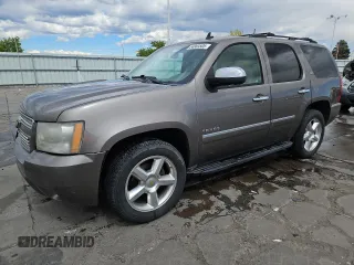 2011 Chevrolet Tahoe LTZ with VIN 1GNSKCE03BR295355, listed as a Copart auction lot 54883505 with 200,128 mi miles and Salvage title. Bid and sale history available at DreamBid. Image 1.