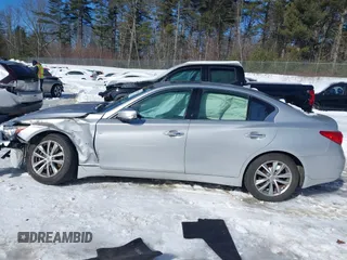 2015 Infiniti Q50 Premium z VIN JN1BV7ARXFM395132, wystawiony jako IAAI lot #41618895 z przebiegiem 96 951 mil mil oraz . Historia ofert i sprzedaży dostępna na DreamBid. Obrazek 13.