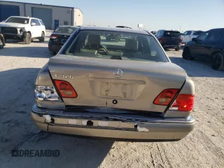 1996 Mercedes-Benz E-Class with VIN WDBJF55F7TJ022765, listed as a Copart auction lot 70577504 with 186,340 mi miles and Salvage Title. Bid and sale history available at carsss.com. Image 6.
