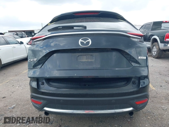2018 Mazda CX-9 Grand Touring with VIN JM3TCADY3J0205878, listed as a IAAI auction lot 42178507 with 243,703 mi miles and . Bid and sale history available at DreamBid. Image 16.