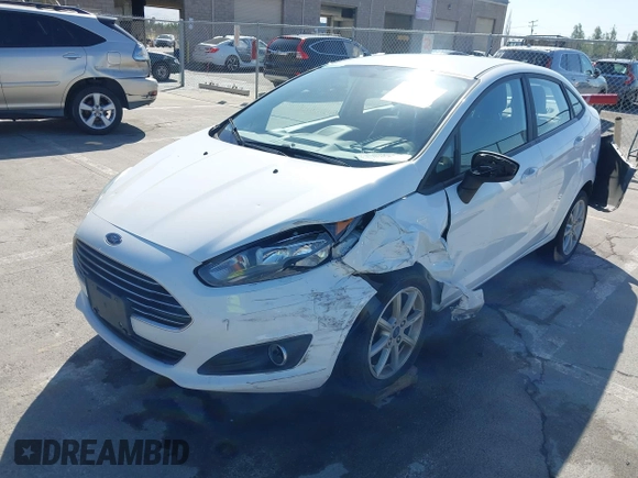 2019 Ford Fiesta SE z VIN 3FADP4BJ6KM143891, wystawiony jako IAAI lot #42244796 z przebiegiem 62 143 mil mil oraz . Historia ofert i sprzedaży dostępna na DreamBid. Obrazek 6.