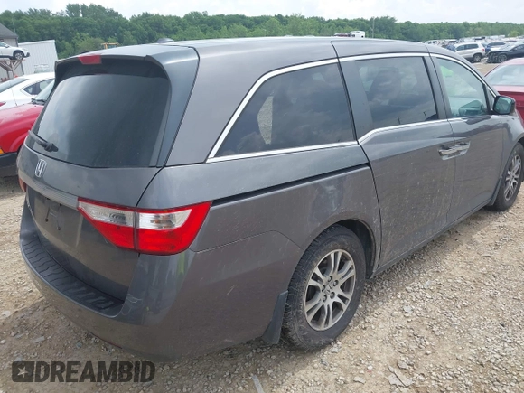 2012 Honda Odyssey EX-L with VIN 5FNRL5H60CB054277, listed as a IAAI auction lot 42459861 with 205,722 mi miles and . Bid and sale history available at DreamBid. Image 4.