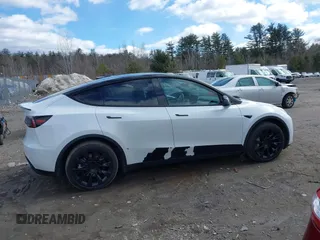 2023 Tesla Model Y Long Range with VIN 7SAYGDEE7PF832007, listed as a IAAI auction lot 41751598 with 14,126 mi miles and . Bid and sale history available at DreamBid. Image 13.