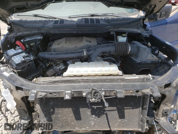2023 Ford F-150 XL with VIN 1FTFW1E8XPKE23518, listed as a Copart auction lot 60340975 with 11,661 mi miles and Salvage title. Bid and sale history available at DreamBid. Image 11.
