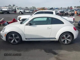 2012 Volkswagen Beetle 2.0T Turbo w/Sun/Snd/Nav PZEV with VIN 3VWVA7ATXCM620731, listed as a IAAI auction lot 41074530 with 99,236 mi miles. Bid and sale history available at carsss.com. Image 14.