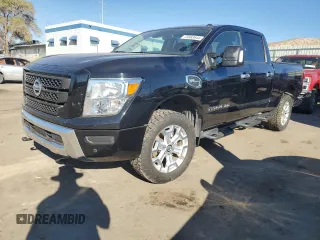 2021 Nissan Titan XD SV with VIN 1N6AA1FB9MN517657, listed as a Copart auction lot 79363644 with 100,628 mi miles and Salvage Title. Bid and sale history available at carsss.com. Image 1.