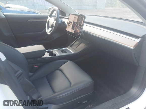 2023 Tesla Model 3 z VIN 5YJ3E1EA9PF576610, wystawiony jako IAAI lot #42206777 z przebiegiem 21 658 mil mil oraz . Historia ofert i sprzedaży dostępna na DreamBid. Obrazek 5.