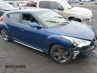 2015 Hyundai Veloster Turbo with VIN KMHTC6AEXFU244298, listed as a IAAI auction lot 41803499 with 76,652 mi miles and . Bid and sale history available at DreamBid. Image 1.