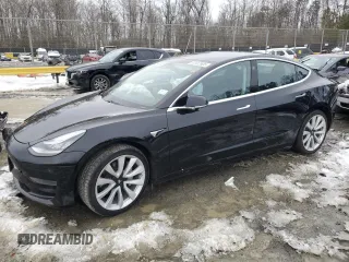 2020 Tesla Model 3 Standard Range Plus with VIN 5YJ3E1EAXLF661031, listed as a Copart auction lot 87912605 with Not Provided miles and Salvage Title. Bid and sale history available at DreamBid. Image 1.