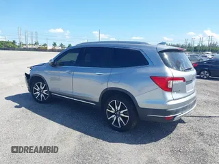 2021 Honda Pilot Touring 8-Passenger with VIN 5FNYF5H99MB041638, listed as a IAAI auction lot 42112915 with 33,230 mi miles and . Bid and sale history available at DreamBid. Image 3.