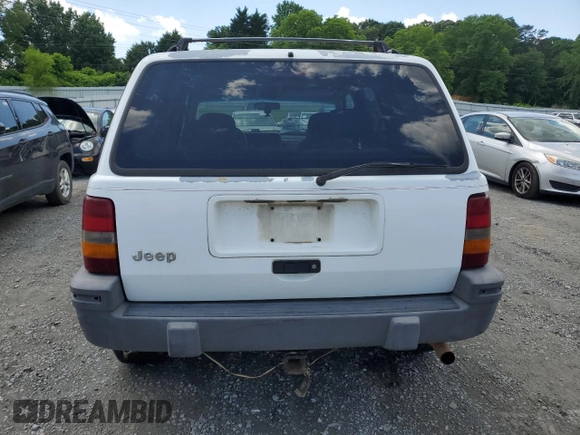 1995 Jeep Grand Cherokee Laredo с VIN 1J4GZ58S5SC724222, выставлен на аукционе Copart как лот 57837155 с пробегом 246 303 миль миль и Списание • Salvage title. История ставок и продаж доступна на DreamBid. Изображение 6.