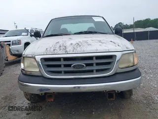 2001 Ford F-150 XL z VIN 1FTRX17L11NB54097, wystawiony jako IAAI lot #42353176 z przebiegiem 258 729 mil mil oraz . Historia ofert i sprzedaży dostępna na DreamBid. Obrazek 6.