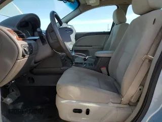 2008 Ford Taurus SEL z VIN 1FAHP24W38G148905, wystawiony jako Copart lot #59186355 z przebiegiem 108 185 mil mil oraz Szkoda całkowita • Salvage title. Historia ofert i sprzedaży dostępna na DreamBid. Obrazek 7.