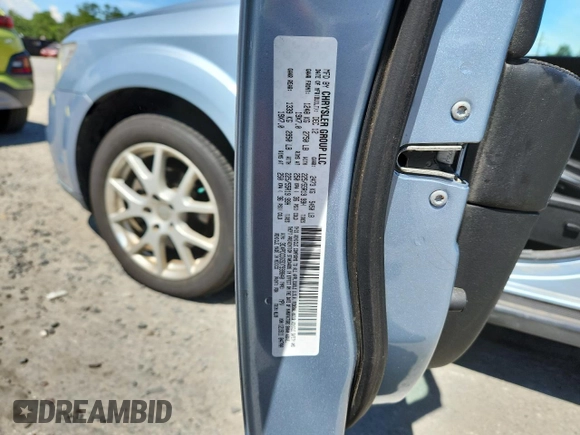 2013 Dodge Journey Crew with VIN 3C4PDCDG5DT599840, listed as a Copart auction lot 62542795 with 102,235 mi miles and Salvage title. Bid and sale history available at DreamBid. Image 13.
