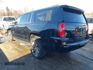 2018 Chevrolet Suburban Premier z VIN 1GNSKJKCXJR134700, wystawiony jako IAAI lot #41282040 z przebiegiem 105 554 mil mil oraz . Historia ofert i sprzedaży dostępna na DreamBid. Obrazek 3.