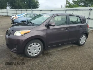2014 Scion xD with VIN JTKKUPB44E1040615, listed as a Copart auction lot 63585775 with 129,457 mi miles and Salvage title. Bid and sale history available at DreamBid. Image 1.