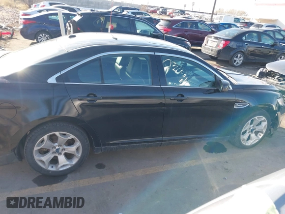 2012 Ford Taurus SEL z VIN 1FAHP2EW3CG128208, wystawiony jako IAAI lot #41020348 z przebiegiem 161 794 mil mil oraz . Historia ofert i sprzedaży dostępna na DreamBid. Obrazek 13.