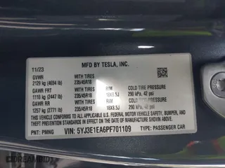 2023 Tesla Model 3 with VIN 5YJ3E1EA6PF701109, listed as a IAAI auction lot 40491628 with 9,989 mi miles. Bid and sale history available at carsss.com. Image 9.