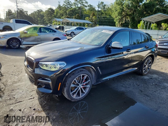 2021 BMW X4 M40i with VIN 5UX2V5C05M9F68427, listed as a Copart auction lot 64941095 with 50,208 mi miles and Salvage title. Bid and sale history available at DreamBid. Image 1.
