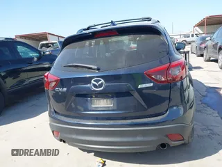 2016 Mazda CX-5 Grand Touring z VIN JM3KE2DY3G0797321, wystawiony jako IAAI lot #42017174 z przebiegiem 65 505 mil mil oraz . Historia ofert i sprzedaży dostępna na DreamBid. Obrazek 16.