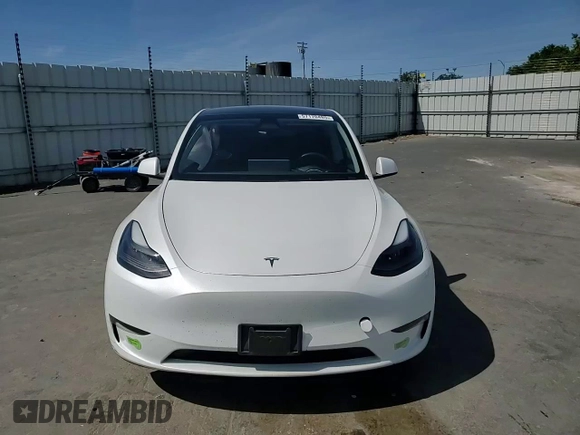 2023 Tesla Model Y Long Range z VIN 7SAYGDEE8PF816544, wystawiony jako Copart lot #57170485 z przebiegiem 74 598 mil mil oraz Szkoda całkowita • Salvage title. Historia ofert i sprzedaży dostępna na DreamBid. Obrazek 13.