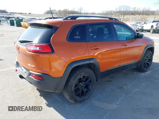 2016 Jeep Cherokee Trailhawk with VIN 1C4PJMBBXGW251682, listed as a IAAI auction lot 41973696 with 100,411 mi miles. Bid and sale history available at carsss.com. Image 4.