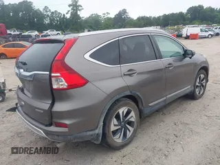 2015 Honda CR-V Touring z VIN 5J6RM3H99FL002315, wystawiony jako IAAI lot #42364421 z przebiegiem 94 018 mil mil oraz . Historia ofert i sprzedaży dostępna na DreamBid. Obrazek 4.