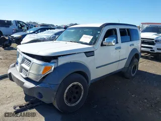 2008 Dodge Nitro SXT with VIN 1D8GU28K28W114449, listed as a IAAI auction lot 41432734 with 246,362 mi miles. Bid and sale history available at carsss.com. Image 2.