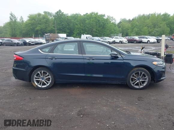 2020 Ford Fusion SEL z VIN 3FA6P0CD9LR183400, wystawiony jako IAAI lot #42271491 z przebiegiem 52 020 mil mil oraz . Historia ofert i sprzedaży dostępna na DreamBid. Obrazek 13.