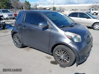 2012 Scion iQ with VIN JTNJJXB00CJ009265, listed as a IAAI auction lot 41742947 with 95,857 mi miles. Bid and sale history available at carsss.com. Image 1.