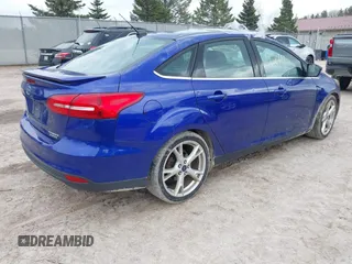 2015 Ford Focus Titanium with VIN 1FADP3J27FL298882, listed as a IAAI auction lot 42117247 with 124,185 mi miles and . Bid and sale history available at carsss.com. Image 4.