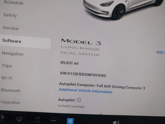 2021 Tesla Model 3 Long Range with VIN 5YJ3E1EBXMF051060, listed as a IAAI auction lot 41958018 with 65,631 mi miles. Bid and sale history available at carsss.com. Image 7.