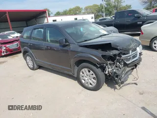 2015 Dodge Journey American Value Pkg with VIN 3C4PDCAB2FT641361, listed as a IAAI auction lot 40299991 with 202,003 mi miles. Bid and sale history available at carsss.com. Image 1.