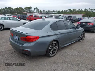 2019 BMW 5 Series M550i xDrive with VIN WBAJB9C57KB289439, listed as a IAAI auction lot 40634389 with 85,992 mi miles and . Bid and sale history available at DreamBid. Image 4.