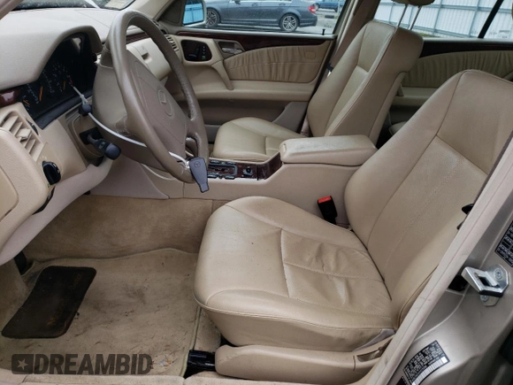 1999 Mercedes-Benz E-Class with VIN WDBJF82H2XX015586, listed as a Copart auction lot 44465455 with 76,890 mi miles and Salvage Title. Bid and sale history available at carsss.com. Image 7.