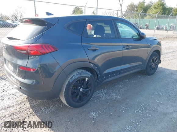 2019 Hyundai Tucson SE with VIN KM8J23A4XKU932814, listed as a IAAI auction lot 40968319 with 107,365 mi miles. Bid and sale history available at carsss.com. Image 4.