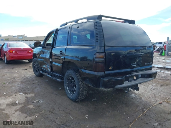 2001 Chevrolet Tahoe LS with VIN 1GNEK13T41R219642, listed as a IAAI auction lot 41655081 with 243,737 mi miles. Bid and sale history available at carsss.com. Image 3.