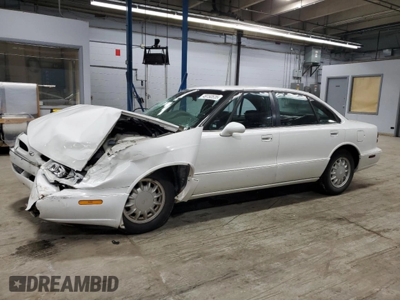1998 Oldsmobile 88 LS z VIN 1G3HN52K9W4823866, wystawiony jako Copart lot #49150535 z przebiegiem 54 125 mil mil oraz Szkody całkowita. Historia ofert i sprzedaży dostępna na DreamBid. Obrazek 1.