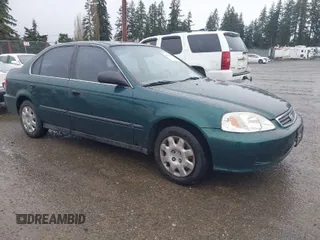 1999 Honda Civic LX with VIN 2HGEJ6673XH507962, listed as a IAAI auction lot 41990900 with 135,874 mi miles. Bid and sale history available at carsss.com. Image 1.