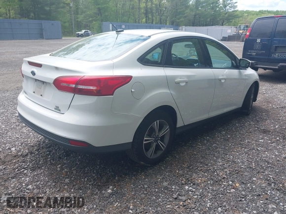 2017 Ford Focus SE with VIN 1FADP3FEXHL233966, listed as a IAAI auction lot 42220832 with 70,197 mi miles and . Bid and sale history available at carsss.com. Image 4.