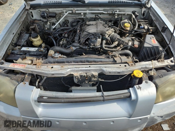 2002 Nissan Frontier XE with VIN 1N6ED29X82C340808, listed as a Copart auction lot 63927075 with 306,615 mi miles and Clean title. Bid and sale history available at DreamBid. Image 11.