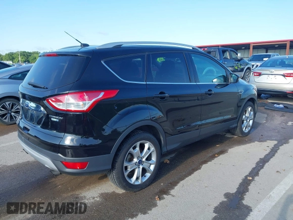 2016 Ford Escape Titanium with VIN 1FMCU9J97GUC21242, listed as a IAAI auction lot 42431567 with 96,946 mi miles and . Bid and sale history available at DreamBid. Image 4.