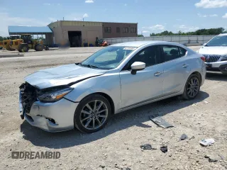 2018 Mazda 3 Touring z VIN 3MZBN1V38JM206858, wystawiony jako Copart lot #62705585 z przebiegiem 85 409 mil mil oraz Szkoda całkowita • Salvage title. Historia ofert i sprzedaży dostępna na DreamBid. Obrazek 1.