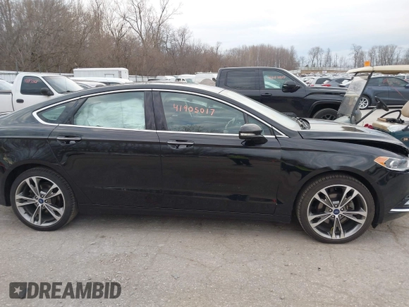 2017 Ford Fusion Titanium z VIN 3FA6P0K98HR200272, wystawiony jako IAAI lot #41905017 z przebiegiem 104 132 mil mil oraz . Historia ofert i sprzedaży dostępna na DreamBid. Obrazek 13.
