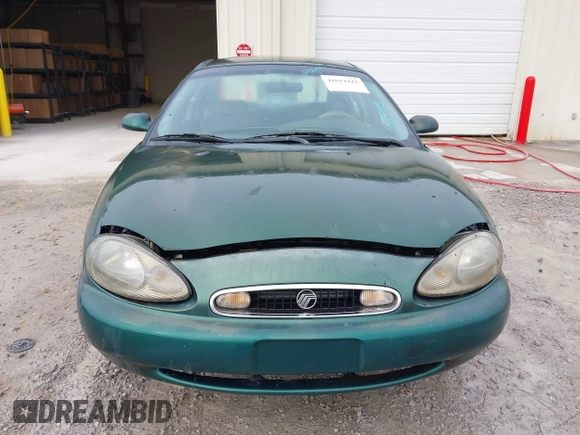 1999 Mercury Sable GS with VIN 1MEFM50U5XG633589, listed as a IAAI auction lot 41614442 with 241,833 mi miles. Bid and sale history available at carsss.com. Image 6.