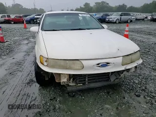 1994 Ford Taurus GL z VIN 1FALP52U5RA152732, wystawiony jako Copart lot #70472324 z przebiegiem 52 781 mil mil oraz Szkoda całkowita • Salvage title. Historia ofert i sprzedaży dostępna na DreamBid. Obrazek 11.