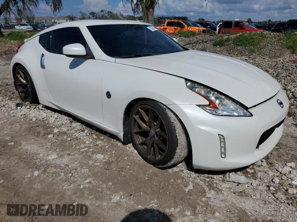 2014 Nissan 370Z Touring with VIN JN1AZ4EH0EM636520, listed as a Copart auction lot 73661434 with 0 mi miles and Salvage Title. Bid and sale history available at carsss.com. Image 4.