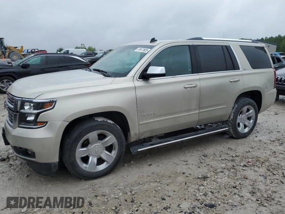 2015 Chevrolet Tahoe LTZ z VIN 1GNSKCKC5FR100084, wystawiony jako Copart lot #57677825 z przebiegiem 141 987 mil mil oraz Czysty tytuł • Clean title. Historia ofert i sprzedaży dostępna na DreamBid. Obrazek 1.