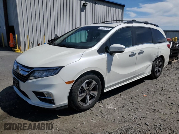 2018 Honda Odyssey Touring with VIN 5FNRL6H8XJB018438, listed as a Copart auction lot 61876505 with 104,581 mi miles and Salvage title. Bid and sale history available at DreamBid. Image 1.