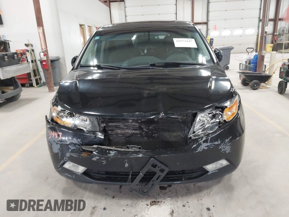 2011 Honda Odyssey Touring with VIN 5FNRL5H9XBB055008, listed as a IAAI auction lot 41973447 with 218,762 mi miles and . Bid and sale history available at DreamBid. Image 12.